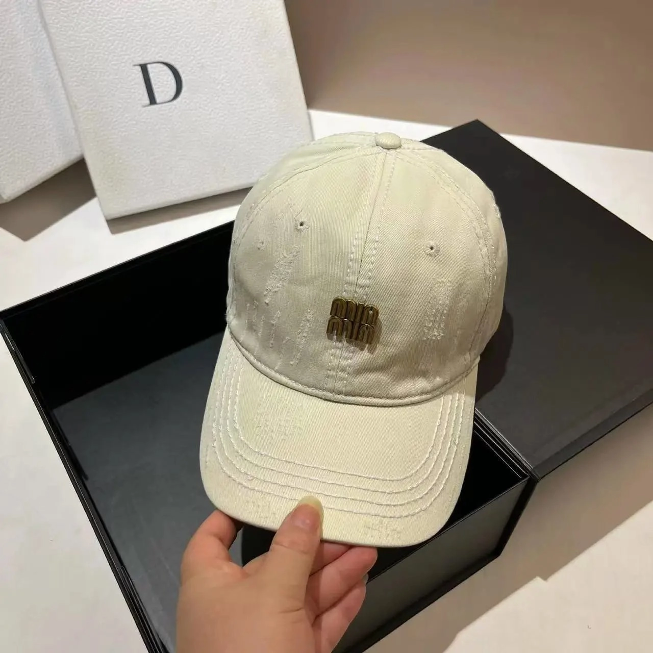 Miu Miu Distressed Cream Baseball Cap with Gold Logo