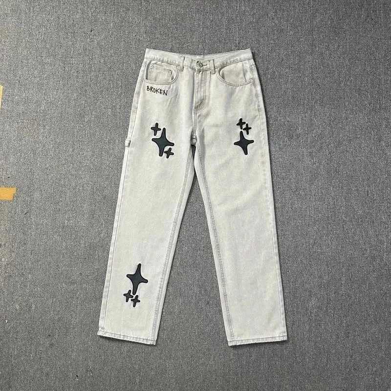 BROKEN Star-Patch Light Wash Denim Jeans with 'BROKEN' Embroidery