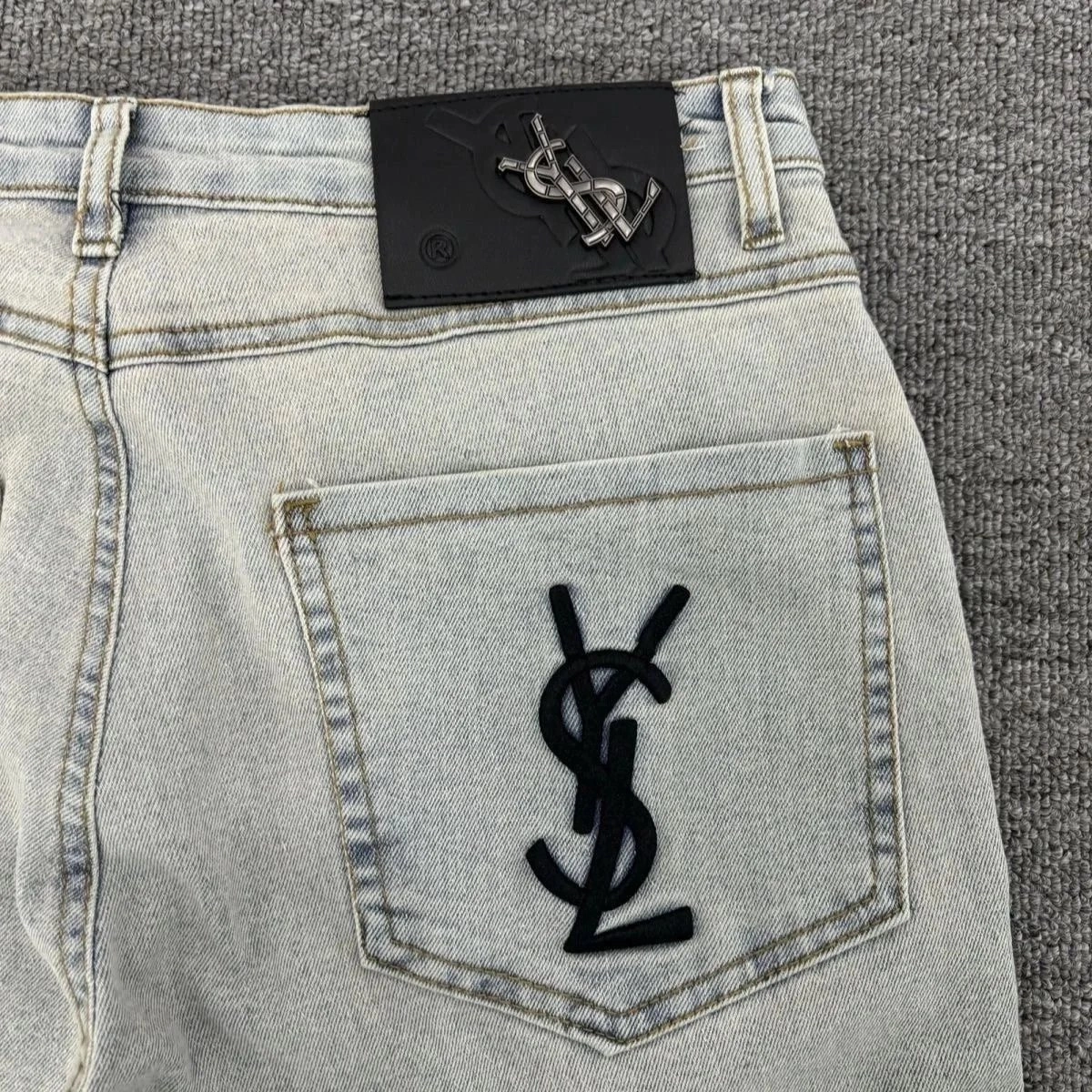 Saint Laurent Monogram Embroidered Light Wash Denim Jeans