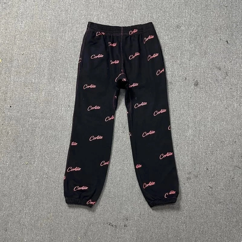 Corteiz All-Over Logo Black Joggers with Pink Script Print