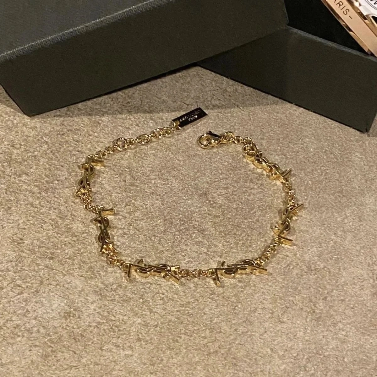 Saint Laurent YSL Monogram Gold Chain Bracelet with Spikes